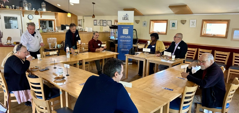 Attendees getting seated at the Camphill Café as Community Connections meeting begins.
